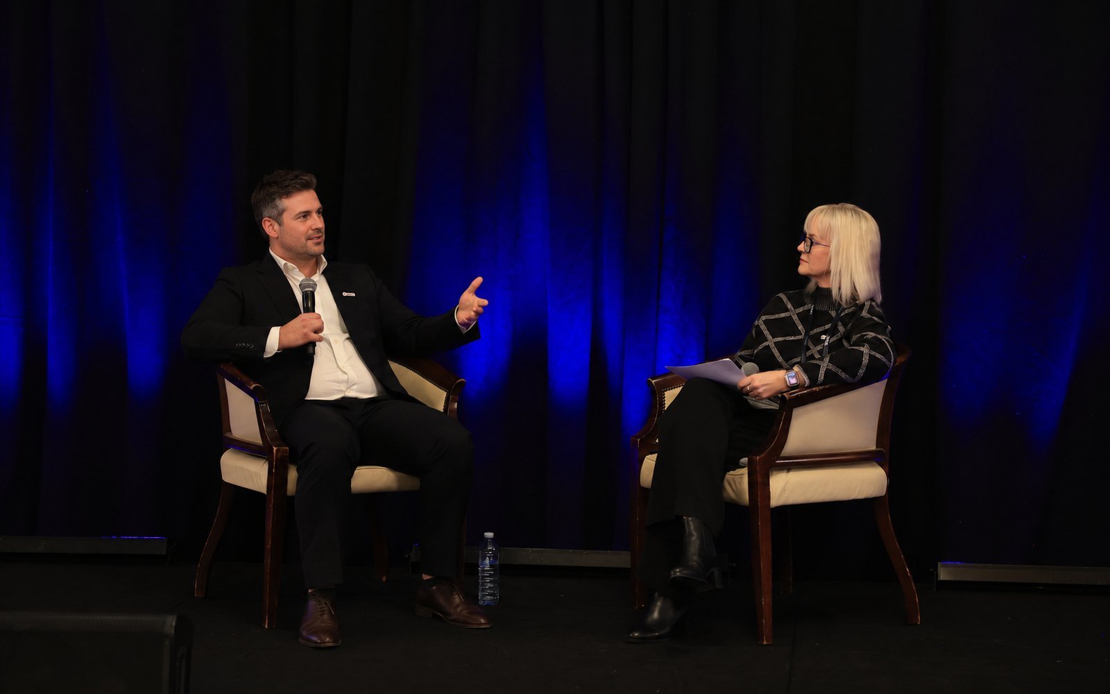 Michelle Rose hosting an on-stage interview